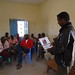 Explaining the SMS feedback system to beneficiaries in Qalooato village.