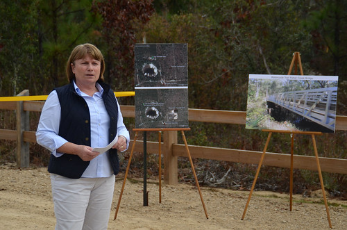 Alex Weiss, Florida Department of Environmental Protection, discussed the benefits of the recently completed Springhill Motorcycle Trailhead on the Apalachicola National Forest to a crowd gathered for its grand opening. The new facility is a short distance from Tallahassee, Fla. (U.S. Forest Service Photo/Susan Blake)
