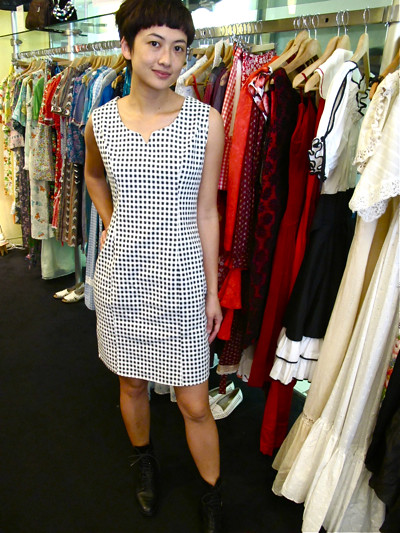 Classic 1980s black and white checkered dress, paired with a pair of grungy 1980s leather lace up boots. Size: M/L
