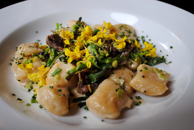 Beef cheek proscuitto, house made dumplings, spring onion, rabe, and fresh kale flowers at Spints Alehouse in NE Portland