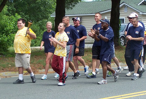 Special Olympics athletes took turns carrying the torch through Kilmarnock
