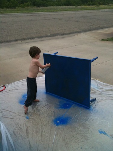 N helps spray paint the Lego table