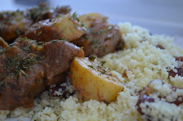 goat stew over couscous with dates