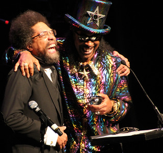 Bootsy Collins giving an award to Cornel West
