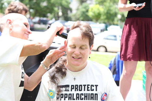 Shaving their heads in mourning and protest of the impacts of mountaintop removal.