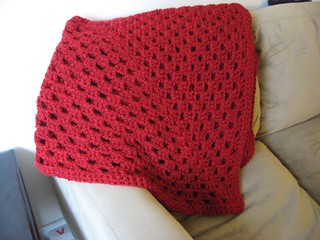 red granny square throw folded