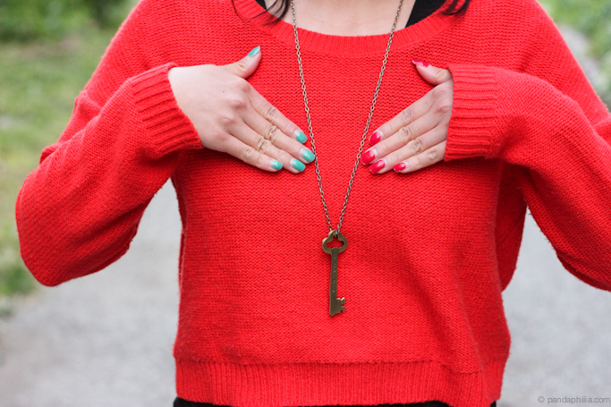 bright nails and key necklace