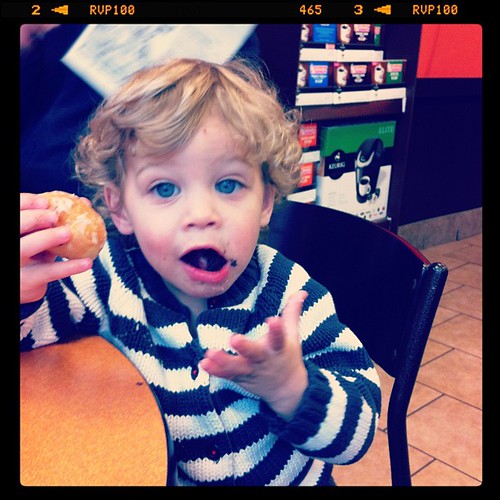 Littlest enjoying his donut hole