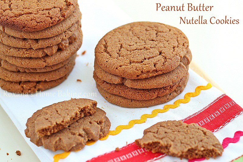 Easy, melt in your mouth peanut butter cookies taken to a whole new level by adding some Nutella to the cookie dough. Recipe from Roxanashomebaking.com
