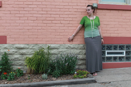 Black and white striped jersey maxi skirt, striped ombré t-shirt with crisscross back, coral and pearl sandals, knotted pearls, ribbon and bead necklace, pavé cable link bracelet from J.Crew, bangles, etc.