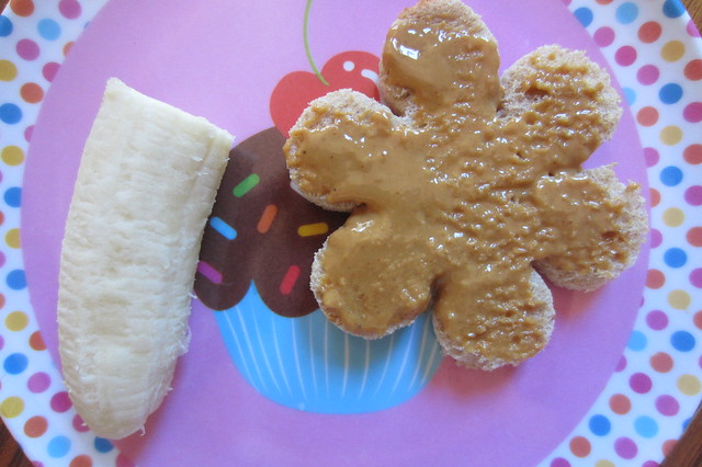 Addy eats: flower shaped toast with peanut butter and 1/2 a banana