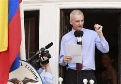 Julian Assange of WikiLeaks speaks at a press conference from the balcony of the Ecuadoran embassy in London. Assange has been granted political asylum by Ecuador. by Pan-African News Wire File Photos
