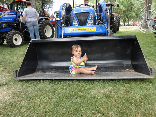 Baby in a tractor shovel