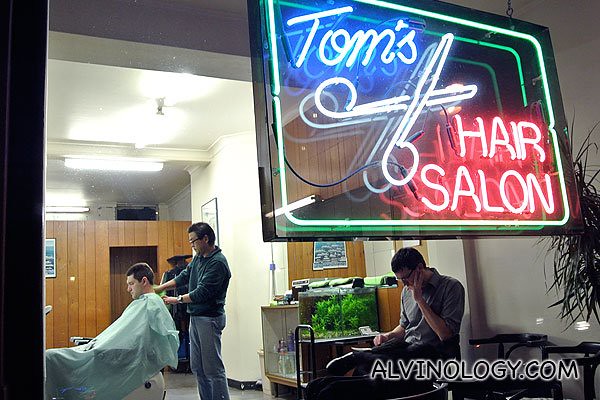 Passed by a normal barber still open at night while walking to the restaurant