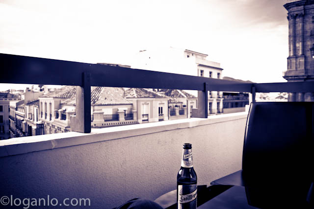 Having a beer on a balcony in Malaga, Spain