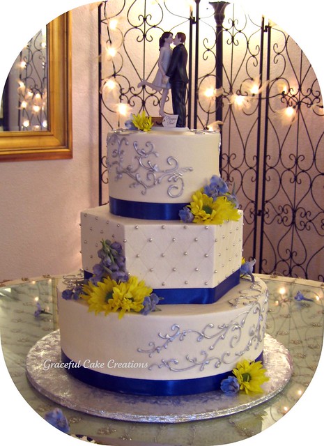 Elegant Ivory Wedding Cake with Blue and Silver Accents