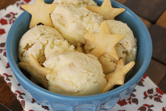 Pecan pie ice cream topped with star shaped pie crust cut outs in a blue bowl 