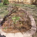 Raised perennial bed cleaned out and beagle fenced March 2012
