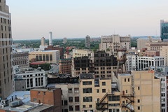 A shot of several downtown buildings from someone's balcony