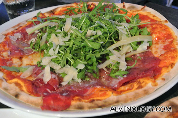 Katerina: Tomato, Mozzarella, Beef Carpaccio, Rucola Salad, shaved Parmesan Cheese