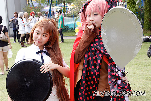 Cosplayers with a tray and a pan