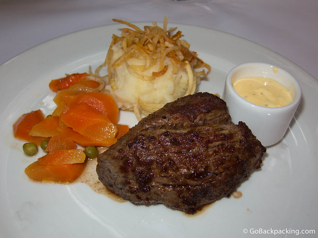 Filet mignon with Bernaise sauce, mashed potatoes, and vegetables