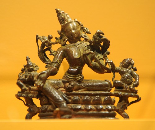 Arya Tara with two Bodhisattvas, on lotus flowers, holding flowers, touched so many times her face has worn down, bronze, jewels, right foot on a lotus bud, Art Institute of Chicago, Illinois, USA by Wonderlane