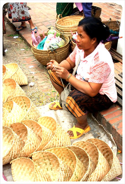 luang prabang morning market basket vendor