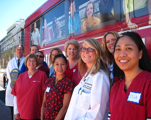 Volunteer Nurses in front of the Medicare For All bus