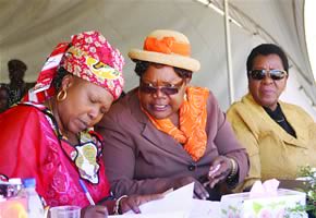 Vice-President Mujuru, Zanu-PF secretary for Women’s Affairs Cde Oppah Muchinguri (left) and President of the Senate Cde Edna Madzongwe exchange notes during celebrations marking the conferring of Cde Mujuru with the Distinguished African Amazon Award. by Pan-African News Wire File Photos