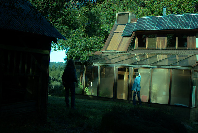 loren amelang's house (sunroom/greenhouse next to him and solar panels on the roof)