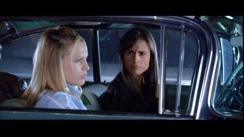 D.E.B.S. Sara Foster and Jordana Brewster share a moment in a car.