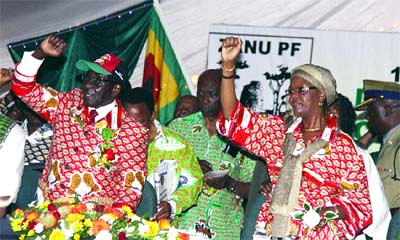 Republic of Zimbabwe President Robert Mugabe with First Lady Amai Grace greeting the delegates to the ZANU-PF 12th Annual National People's Conference held in Bulawayo. The party is preparing for elections in 2012. by Pan-African News Wire File Photos