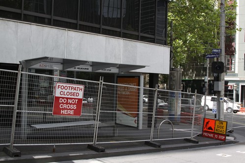 'Footpath closed' sign at William Street and Flinders Lane, the area blocked off in case anything else falls