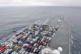 The aircraft carrier USS Ronald Reagan transports Sailors’ vehicles.