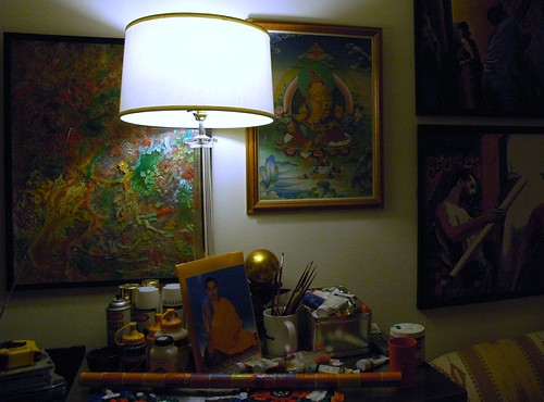 Painters table with lamp, paintings, formal Tibetan style photo of HE Dezhung Rinpoche the 4th, paint brushes, acrylic paint, sofa, Tibetan painting, Greenwood, Seattle, Washington, USA by Wonderlane
