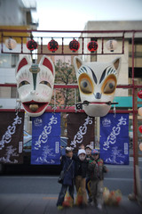 Souvenir picture with huge masks of fox.