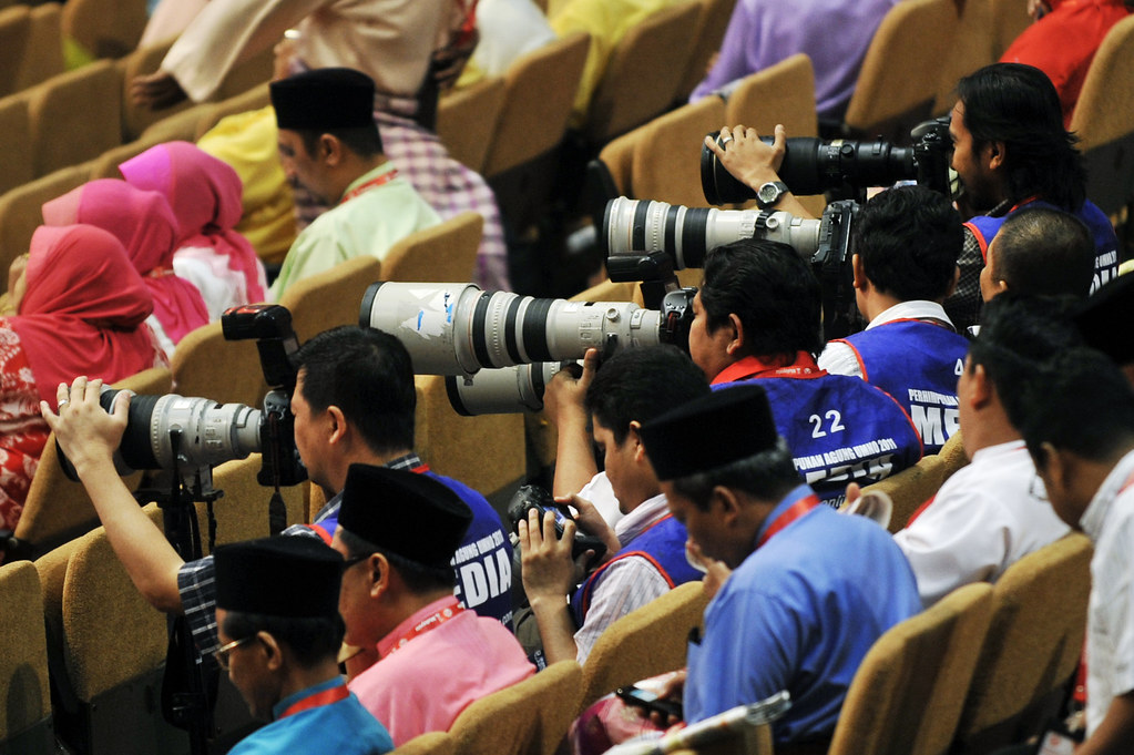 The Photographer | The Photojournalist at Work | UMNO 2011 | PWTC | Malaysia