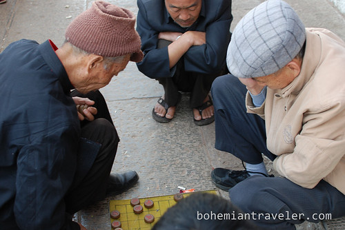 old men playing Chinese chess atop Chaoyang Gate of Jianshui Yunnan