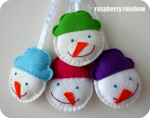 Four happy snow men all in a row.