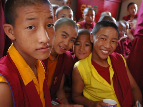 Young Tibetan boy monks in traditional robes, pose for a photo, side room, Sakya Lamdre, Tharlam Monastery of Tibetan Buddhism, Tharlam Monastery, Boudha, Kathmandu, Nepal by Wonderlane