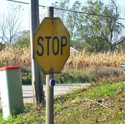 yellow stop sign