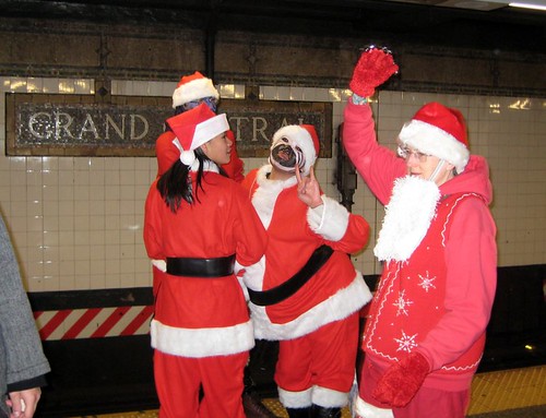 Santas rock the subway at Grand Central (by: Sam Berlin, creative commons license)