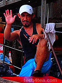 A local fish seller waving Selamat Pagi.
