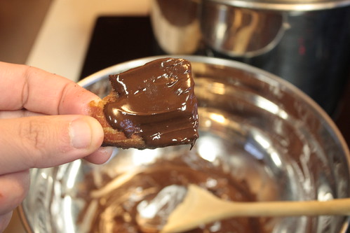 Dipping, dredging or otherwise covering the bacon with chocolate.