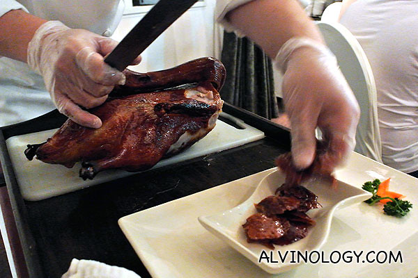 Slicing the skin from the neck first