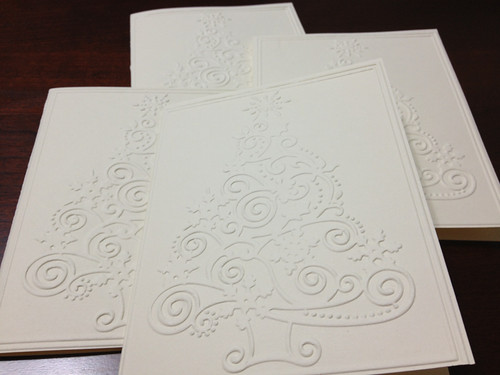 A few Christmas cards with an embossed image of a stylized Christmas tree