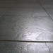Green floor tiles - closeup detail of texture (winter sunlight)