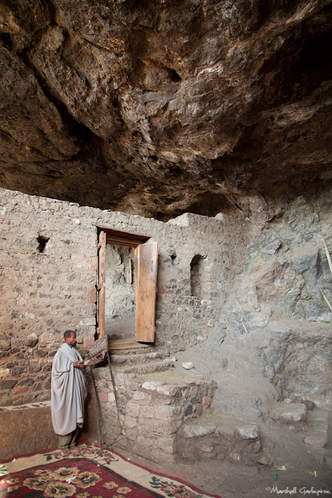 Man in cave praying