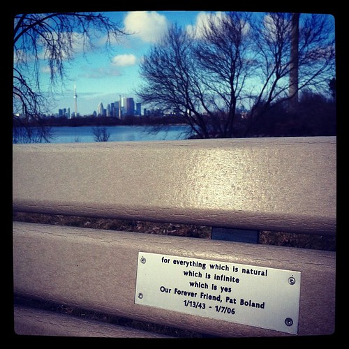 Inscription on a memorial bench. If you sit there, you see the lake spread before you while the sun warms your face.